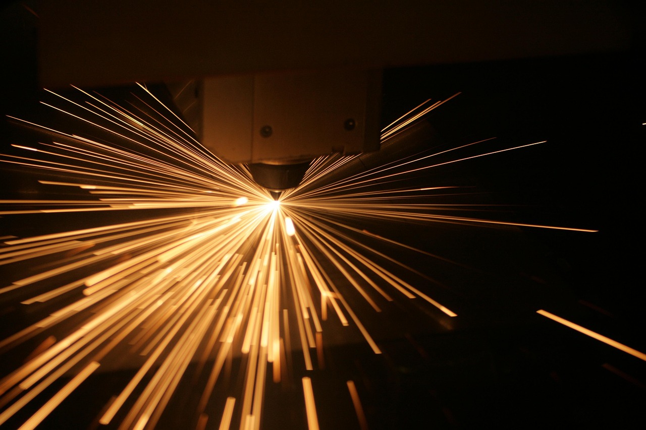 Bright sparks fly from a welding device