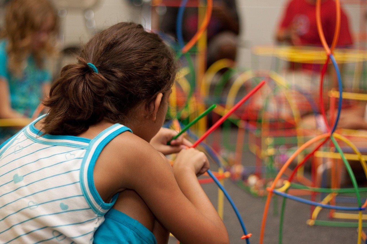 A child works with an educaitonal toy.
