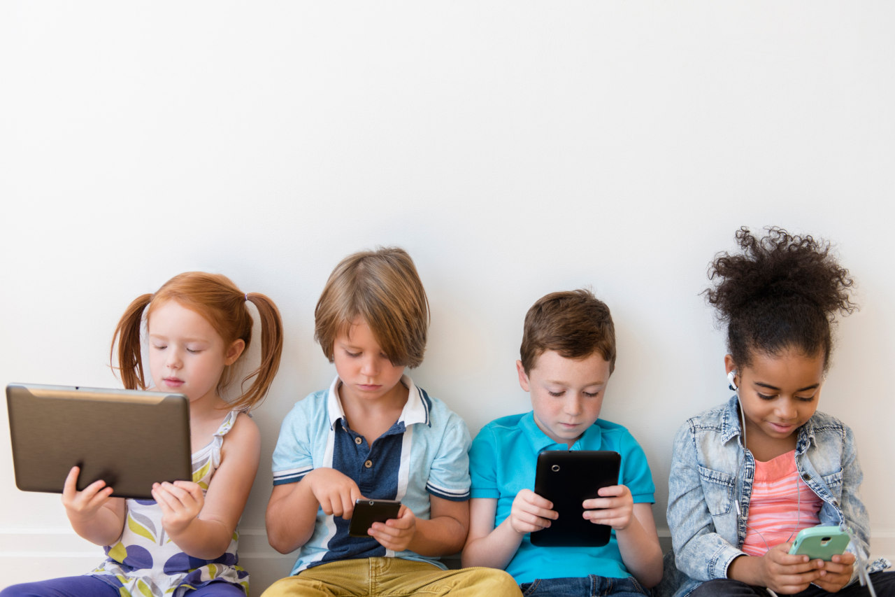 Kids using devices-cell phone, tablet computer, laptop computer